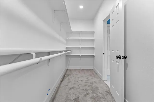 a view of a hallway with closet