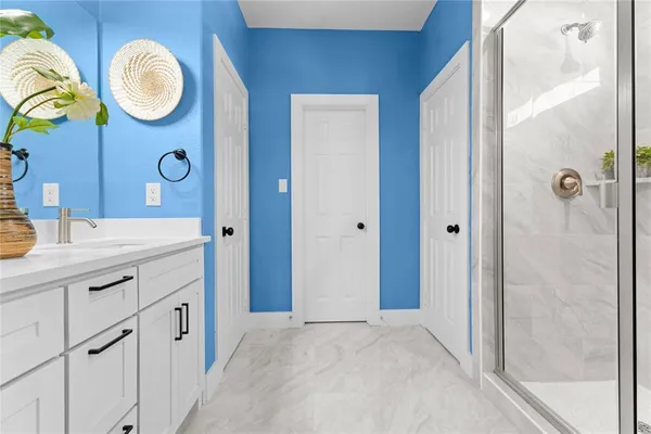 a bathroom with a double vanity sink and a mirror