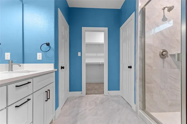 a bathroom with a double vanity sink and a mirror