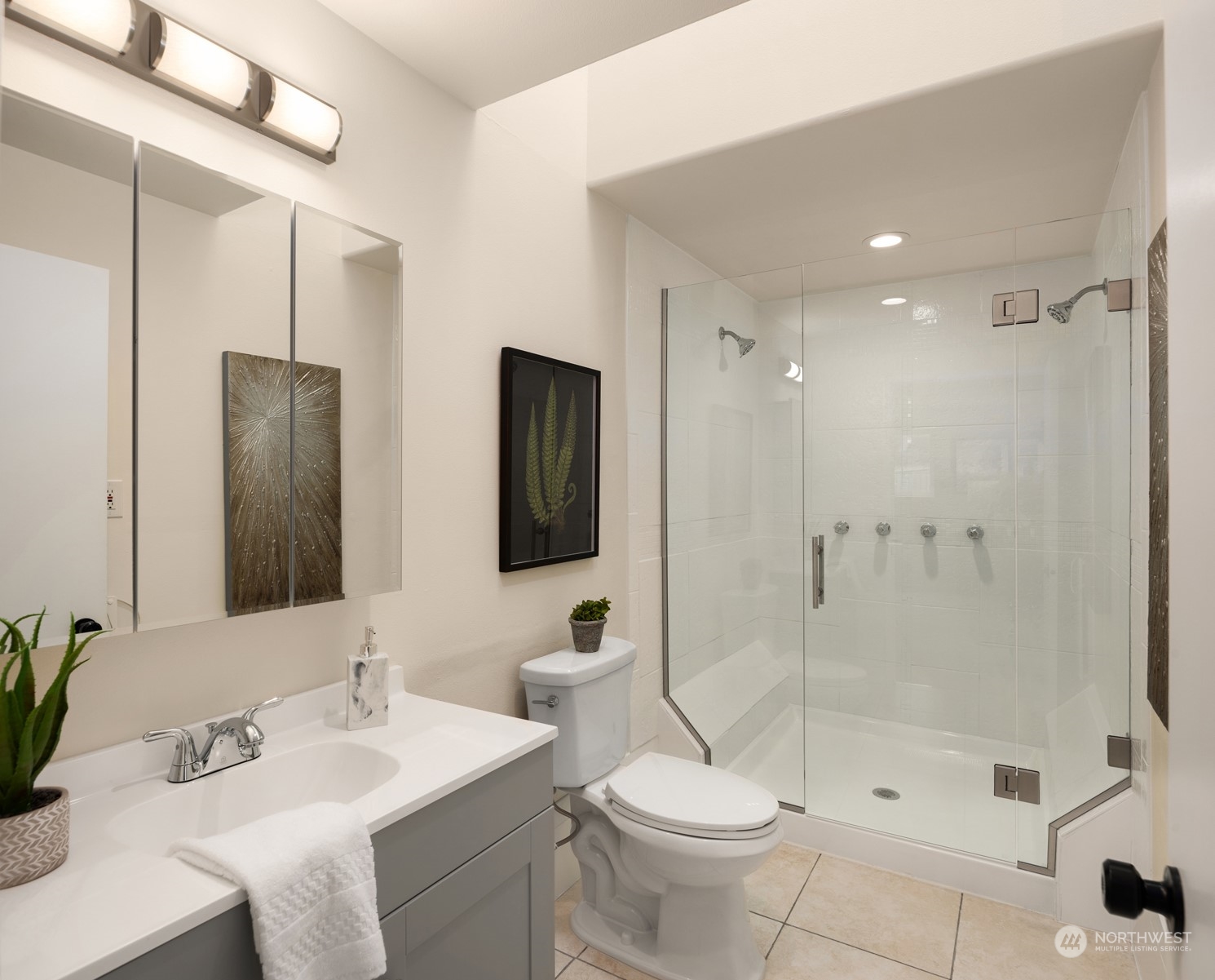 4103 223rd Street Southwest Mountlake Terrace, WA 98043 - Photo 14 of 38 a bathroom with a sink a toilet and shower