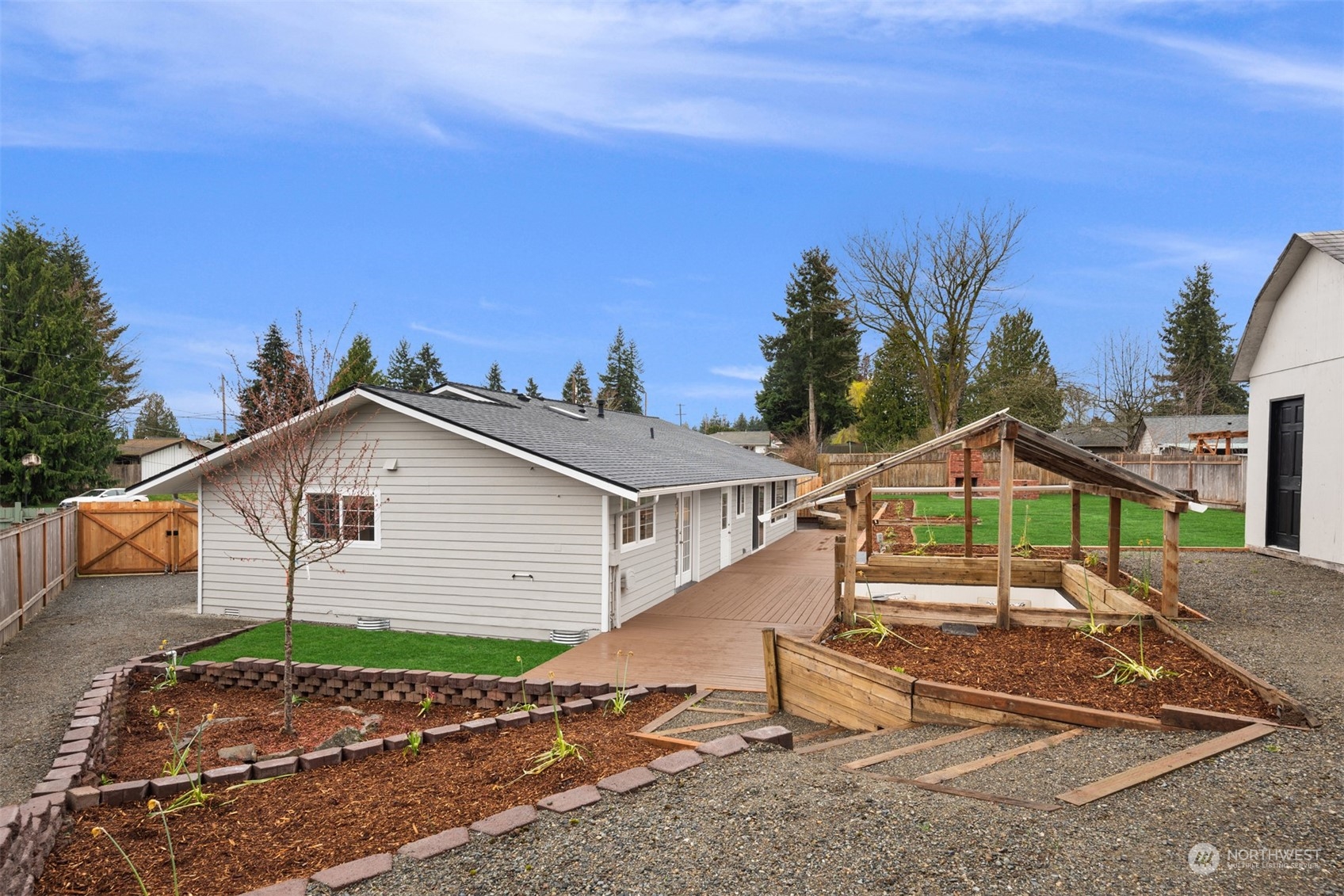 4103 223rd Street Southwest Mountlake Terrace, WA 98043 - Photo 26 of 38 a front view of a house with a yard