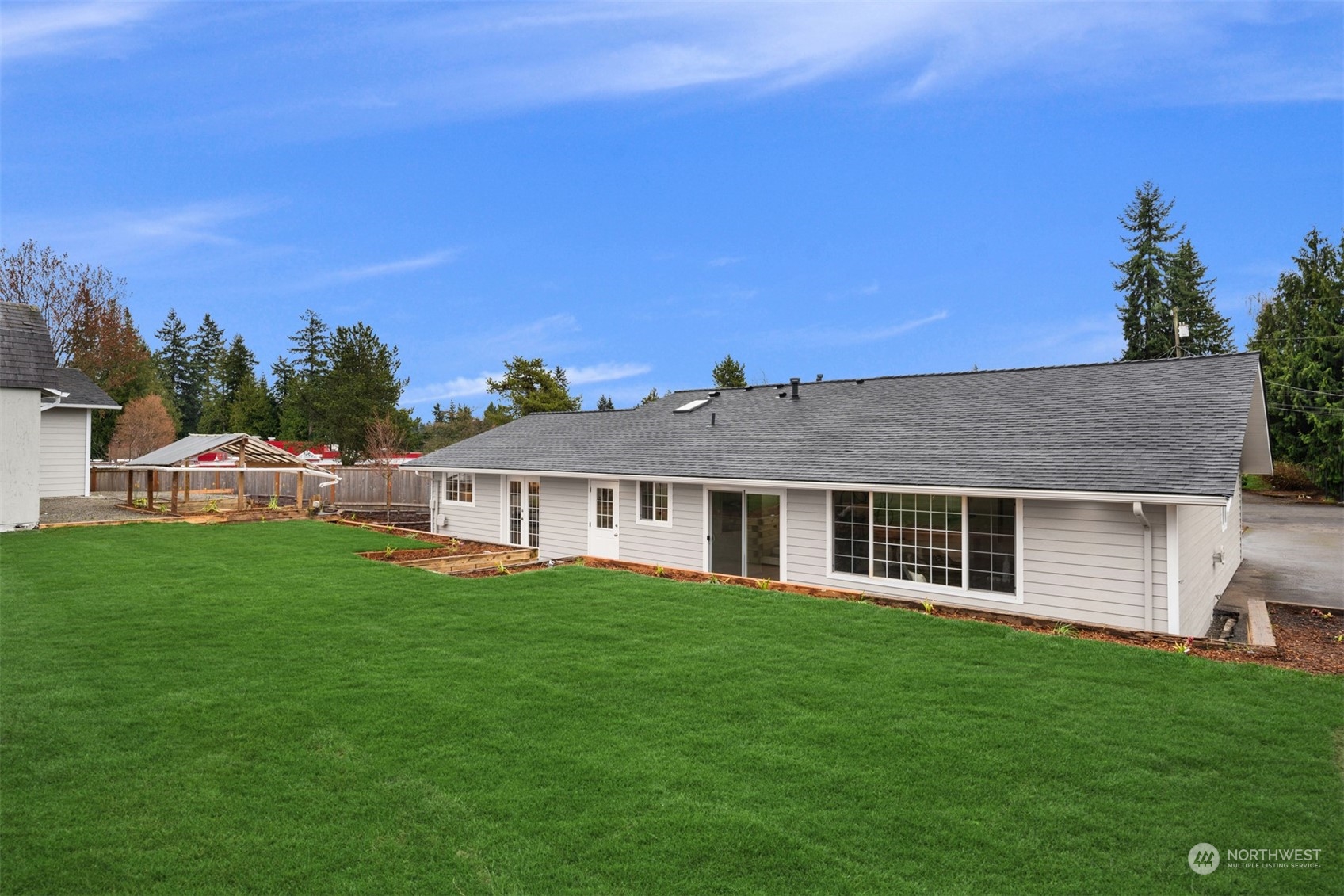 4103 223rd Street Southwest Mountlake Terrace, WA 98043 - Photo 30 of 38 a view of a house with a backyard