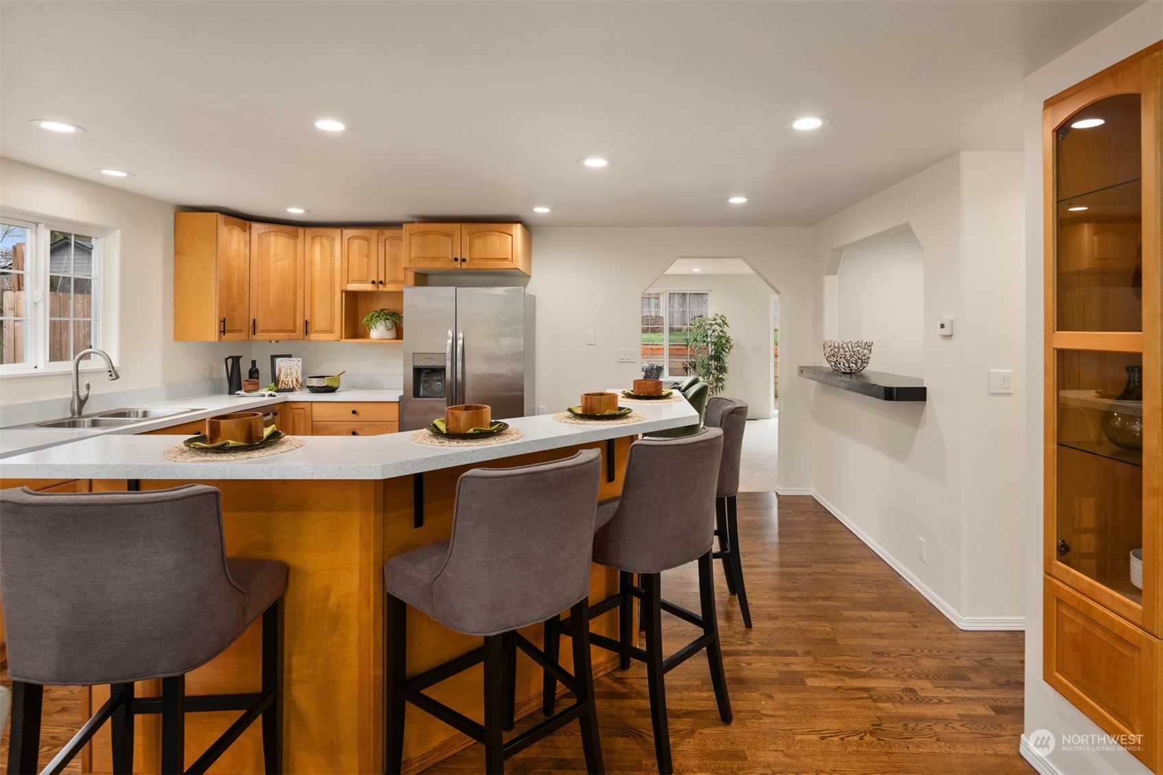 4103 223rd Street Southwest Mountlake Terrace, WA 98043 - Photo 4 of 38 a kitchen with a table chairs sink and cabinets