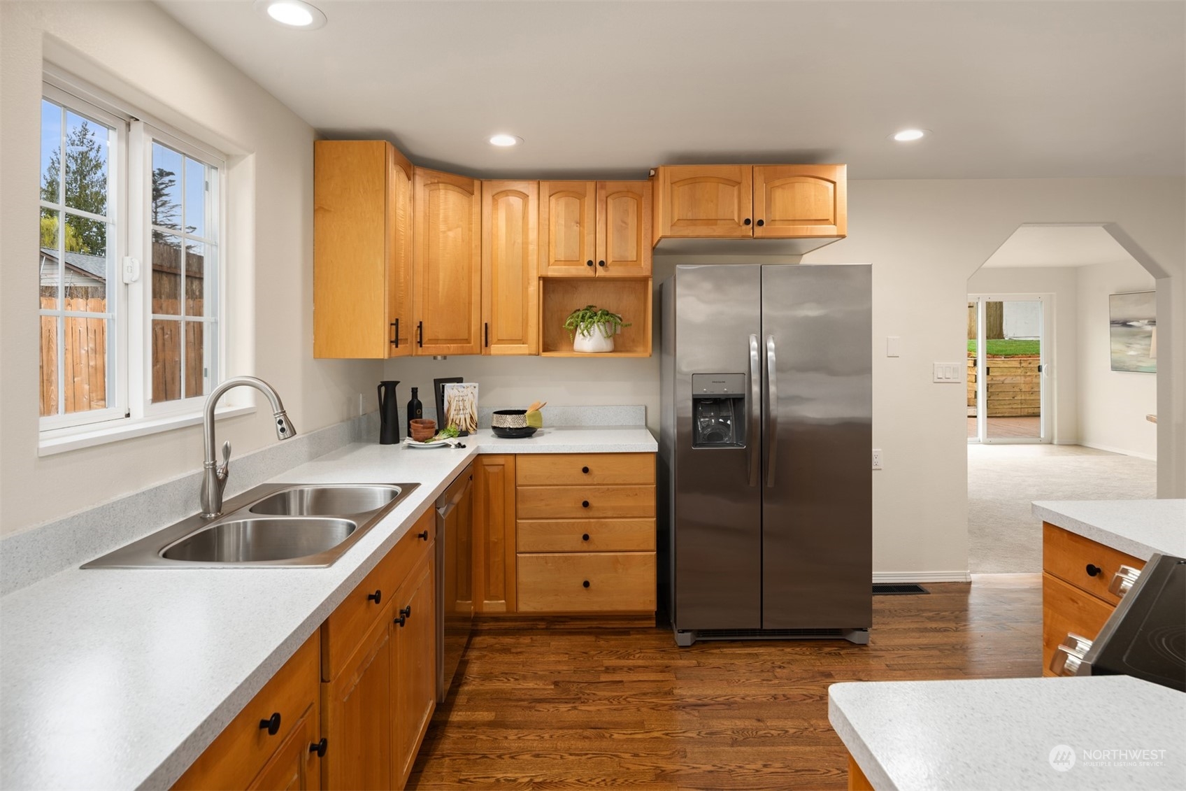 4103 223rd Street Southwest Mountlake Terrace, WA 98043 - Photo 5 of 38 a kitchen with a refrigerator sink and cabinets