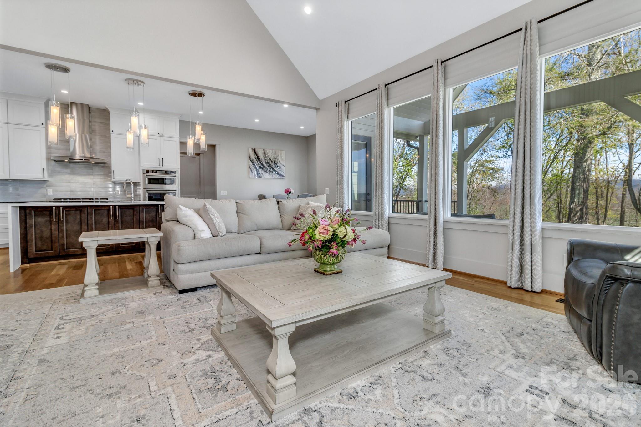 301 Rockbridge Road Mills River, NC 28759 - Photo 11 of 48 a living room with furniture and a large window