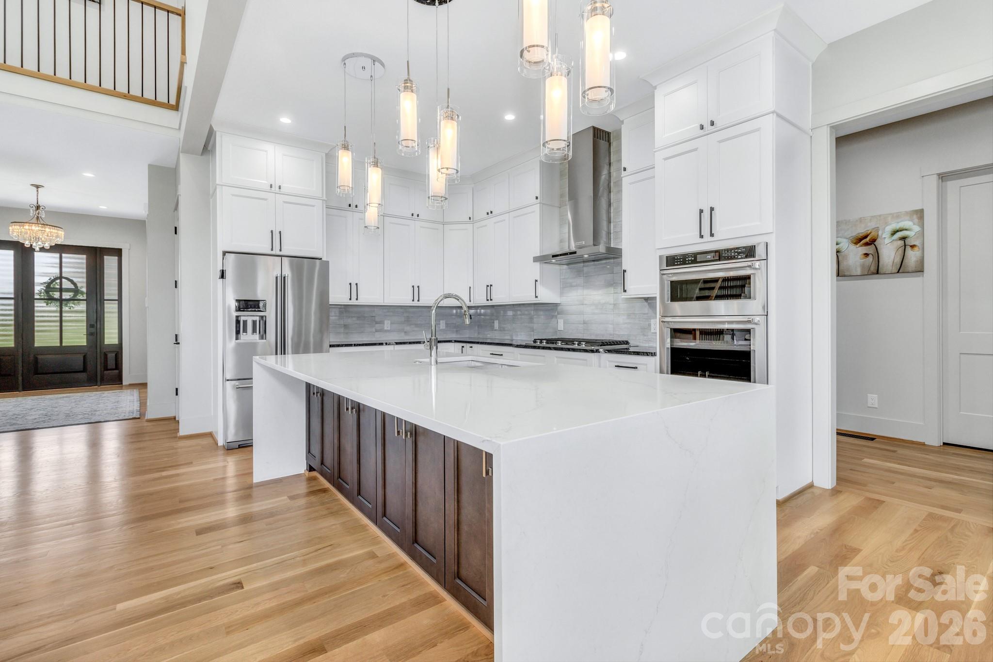 301 Rockbridge Road Mills River, NC 28759 - Photo 13 of 48 a kitchen with stainless steel appliances a refrigerator and a stove top oven