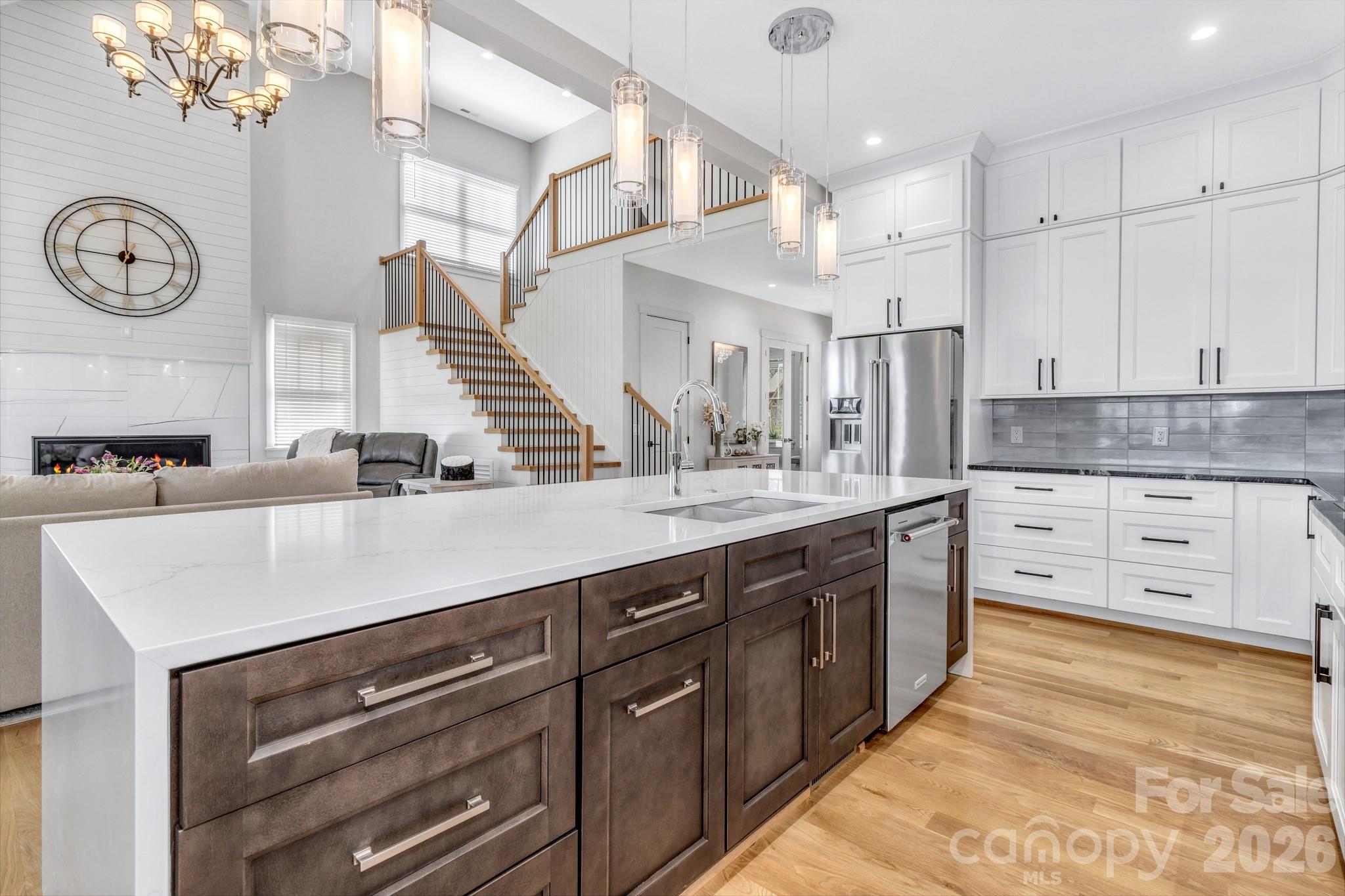 301 Rockbridge Road Mills River, NC 28759 - Photo 16 of 48 a kitchen with stainless steel appliances granite countertop a white cabinets and a stove