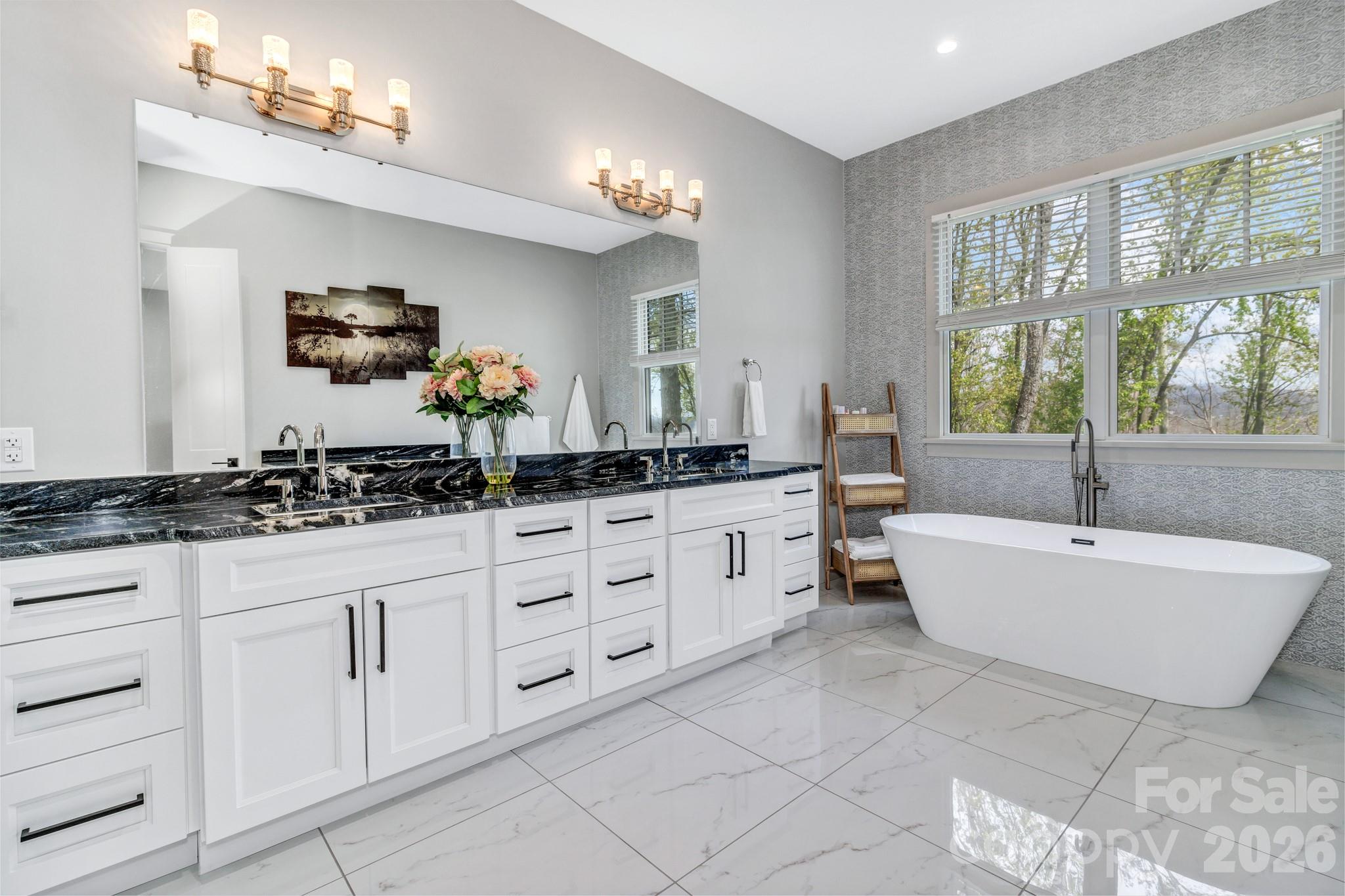 301 Rockbridge Road Mills River, NC 28759 - Photo 23 of 48 a spacious bathroom with a double vanity sink large mirror and a bathtub