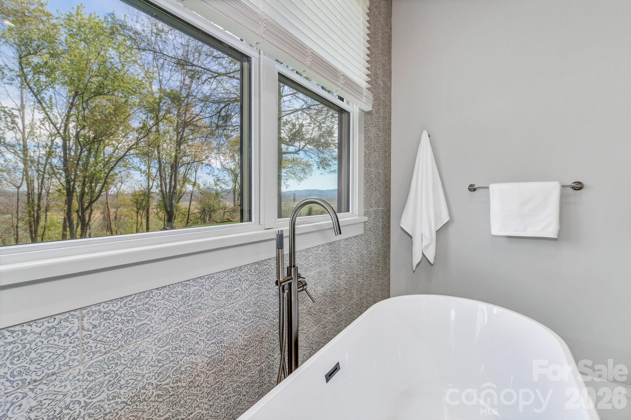 301 Rockbridge Road Mills River, NC 28759 - Photo 25 of 48 a bathroom with a bathtub and a shower