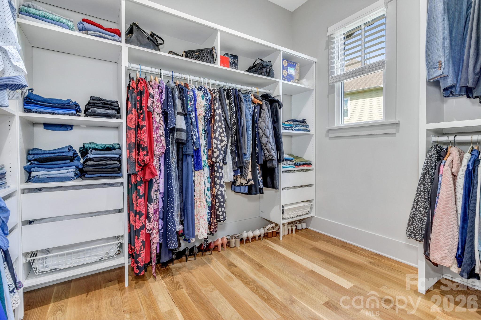 301 Rockbridge Road Mills River, NC 28759 - Photo 26 of 48 a view of walk in closet with clothes and shoes