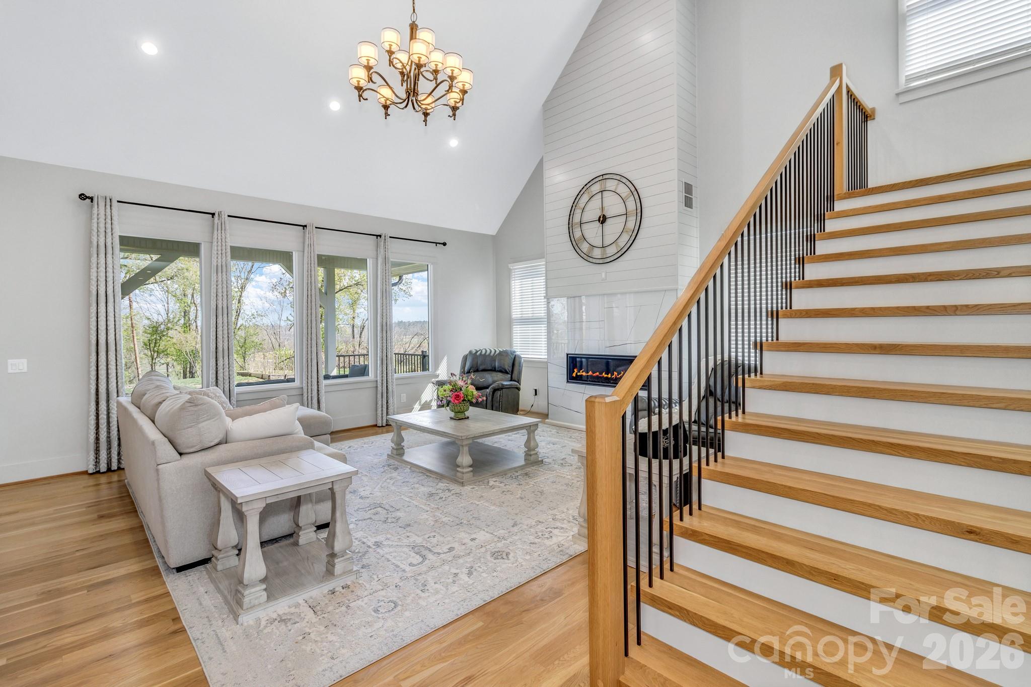 301 Rockbridge Road Mills River, NC 28759 - Photo 29 of 48 a living room with furniture and a chandelier