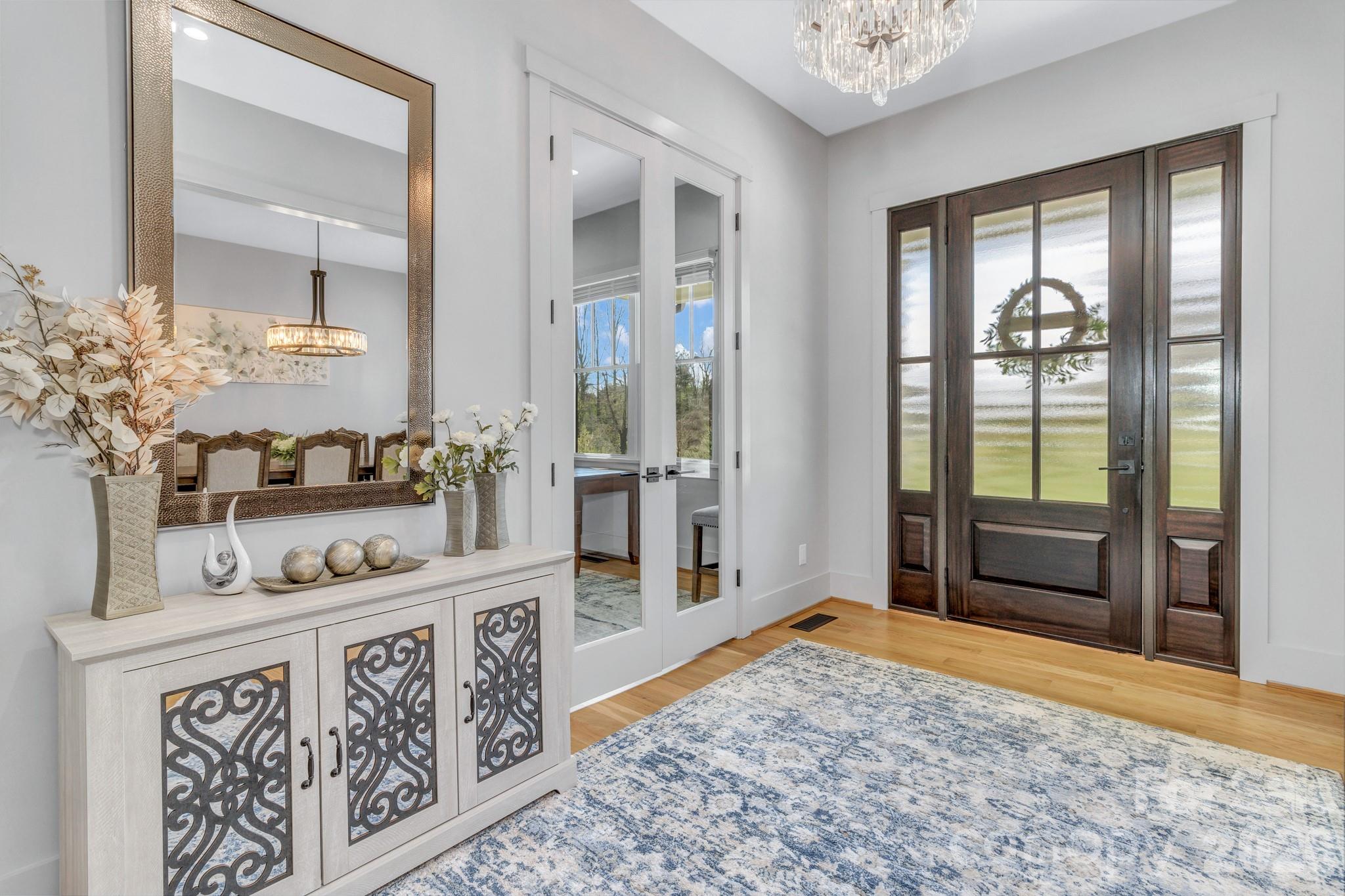 301 Rockbridge Road Mills River, NC 28759 - Photo 3 of 48 a bathroom with a granite countertop sink and a mirror