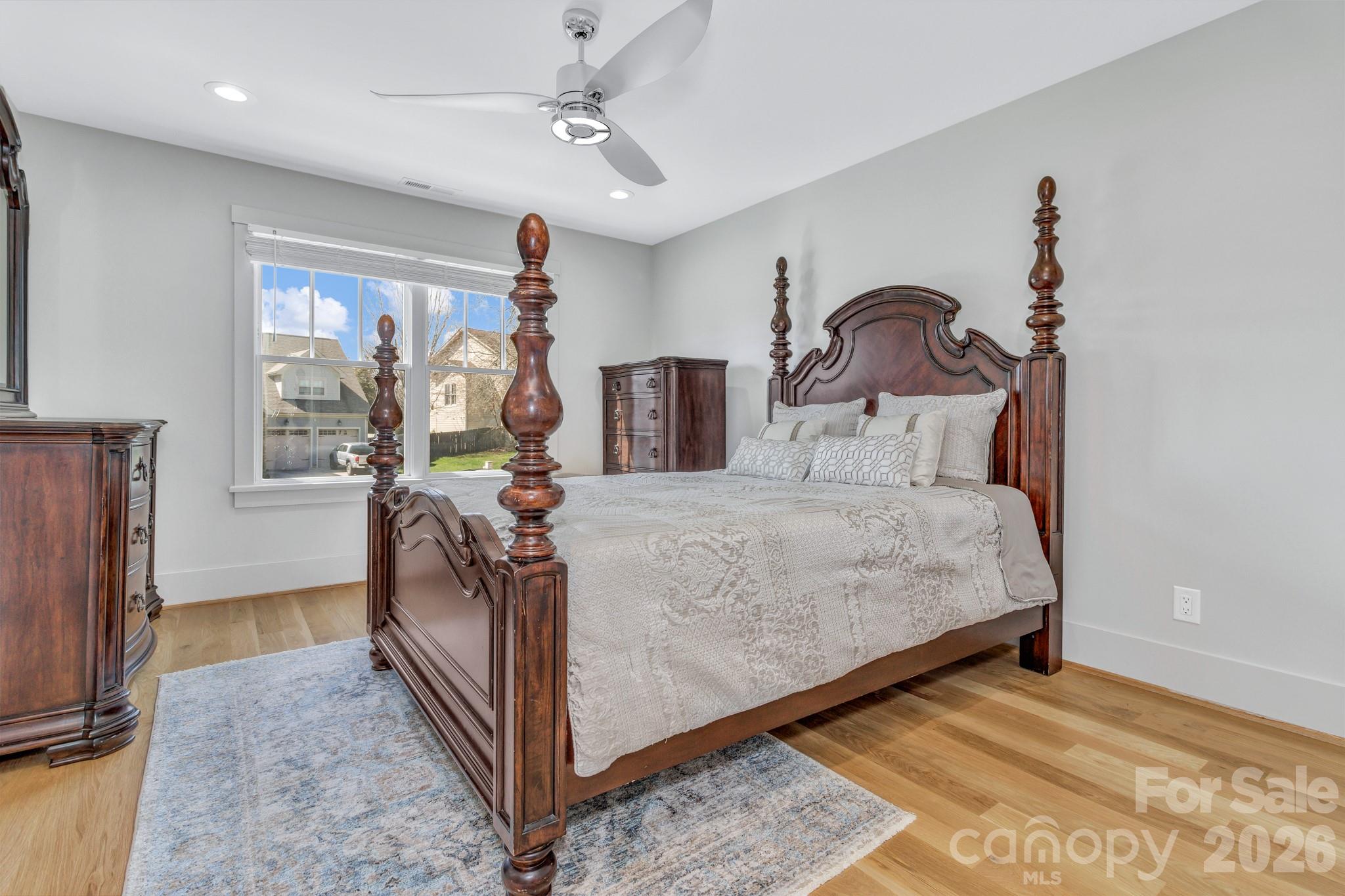 301 Rockbridge Road Mills River, NC 28759 - Photo 36 of 48 a bed room with a bed and a chandelier