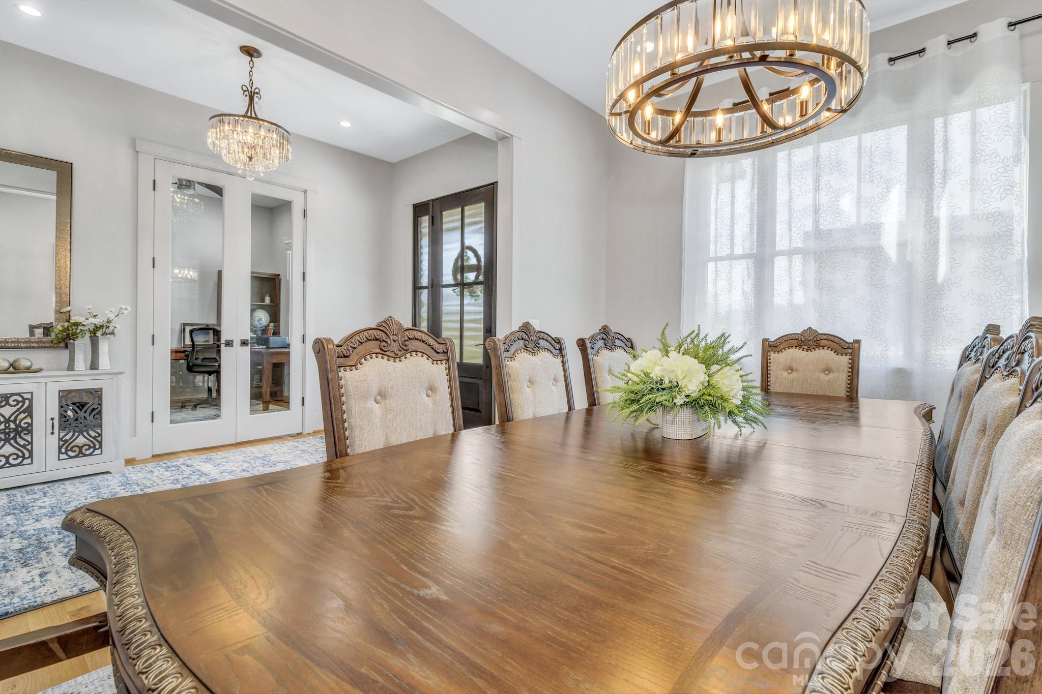 301 Rockbridge Road Mills River, NC 28759 - Photo 6 of 48 a view of a dining room with furniture wooden floor and chandelier
