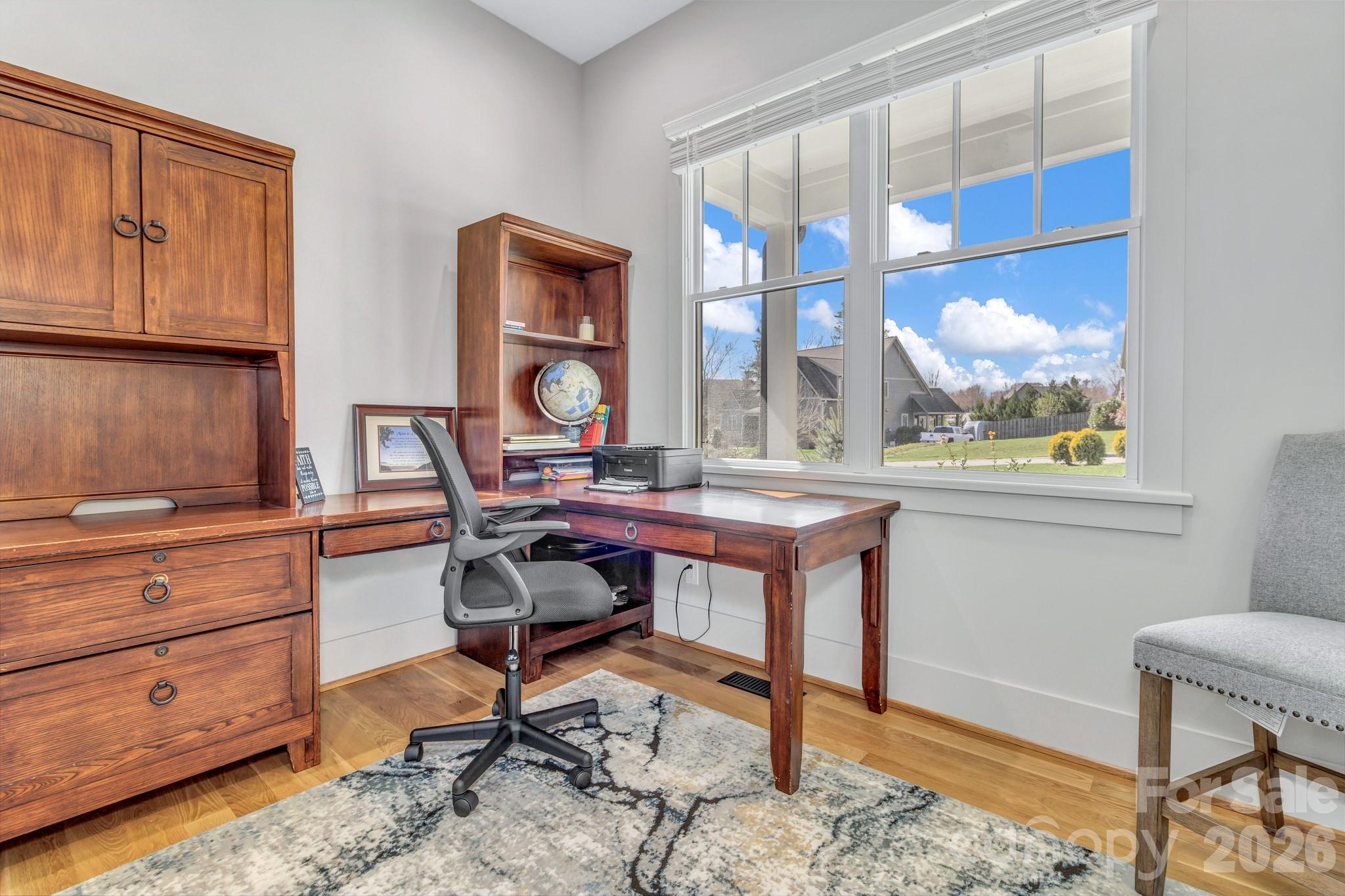 301 Rockbridge Road Mills River, NC 28759 - Photo 7 of 48 a view of a workspace with furniture and a window