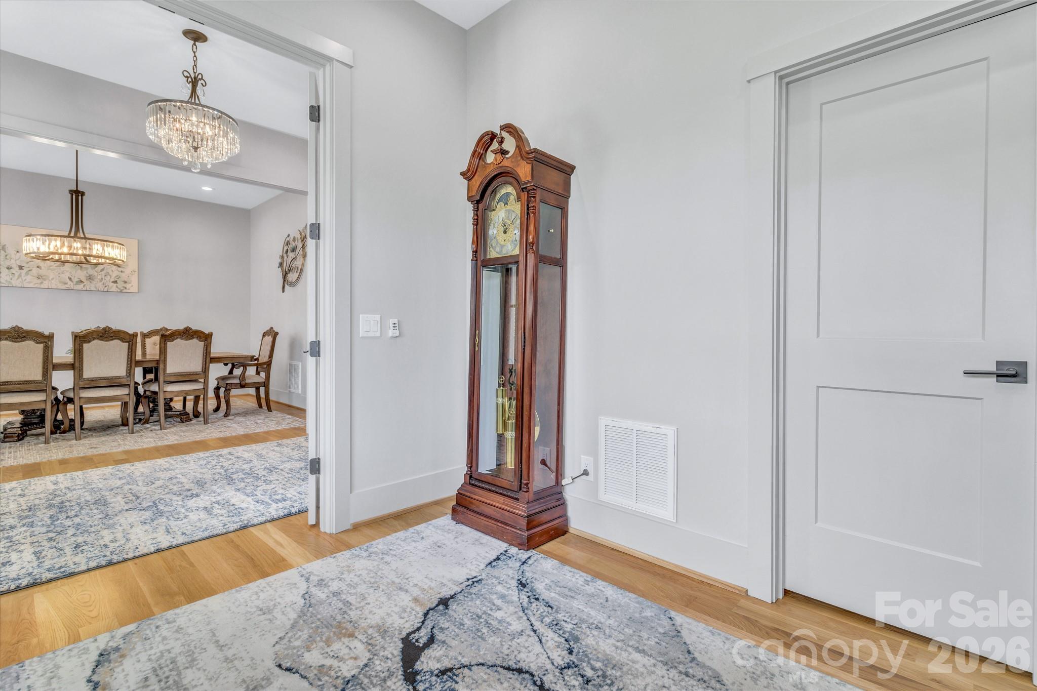 301 Rockbridge Road Mills River, NC 28759 - Photo 8 of 48 a bedroom with a bed and a chandelier