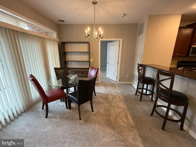 a living room with a couch and a walk in closet
