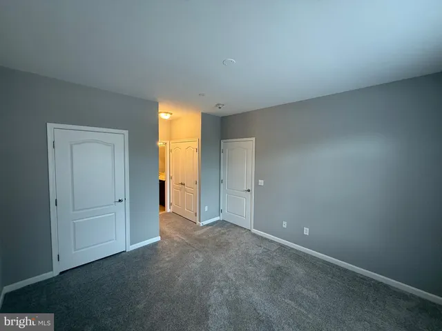 a bathroom with a tub sink and shower
