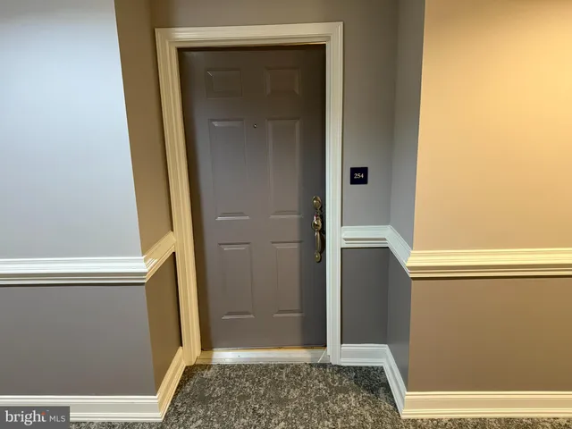 a view of kitchen with wooden floor and electronic appliances