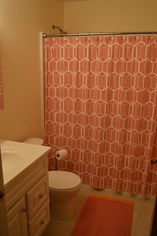 1 Fillmore Road, Unit 3AC Salem, MA 01970 - Photo 8 of 11 a bathroom with a sink a toilet and a mirror