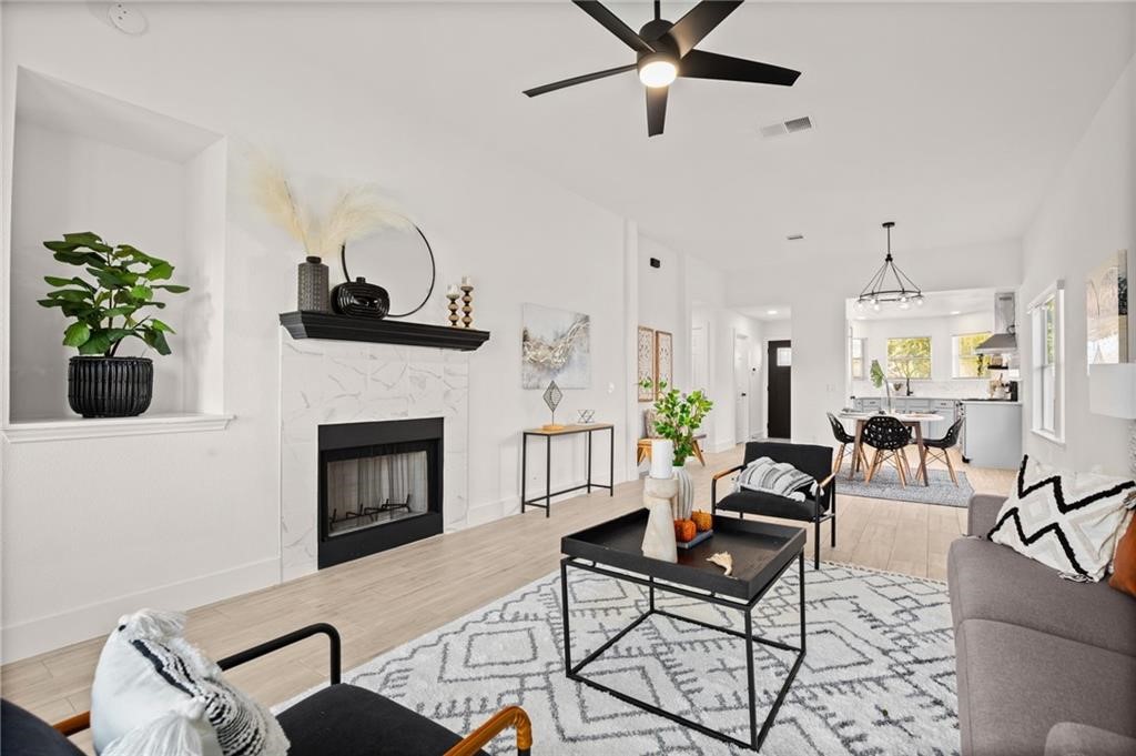 16724 Trevin Cove Manor, TX 78653 - Photo 13 of 32 a living room with furniture and a fireplace