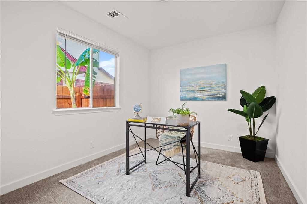 16724 Trevin Cove Manor, TX 78653 - Photo 23 of 32 a view of a workspace with furniture