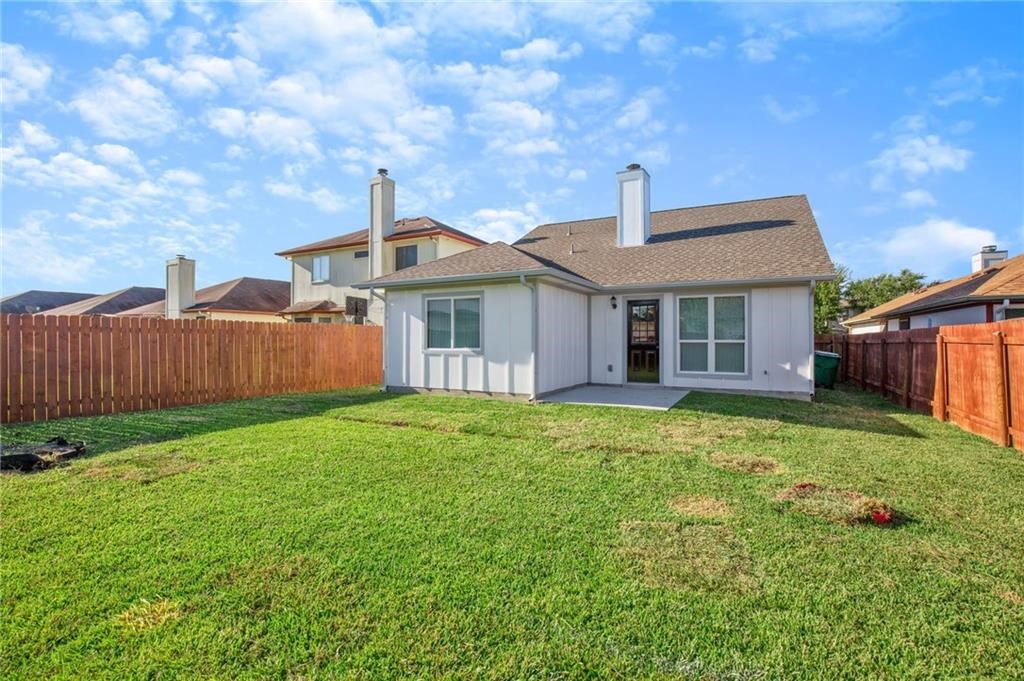 16724 Trevin Cove Manor, TX 78653 - Photo 26 of 32 a front view of a house with garden