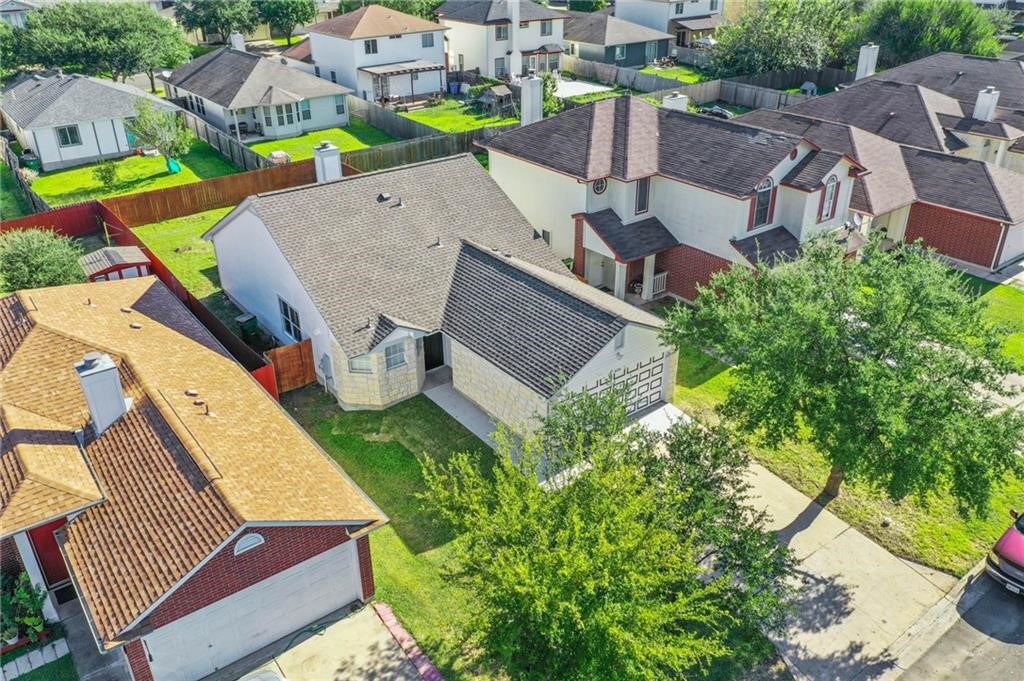 16724 Trevin Cove Manor, TX 78653 - Photo 28 of 32 an aerial view of a house with a garden