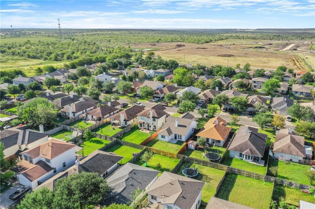 16724 Trevin Cove Manor, TX 78653 - Photo 30 of 32 an aerial view of residential houses with outdoor space and ocean view