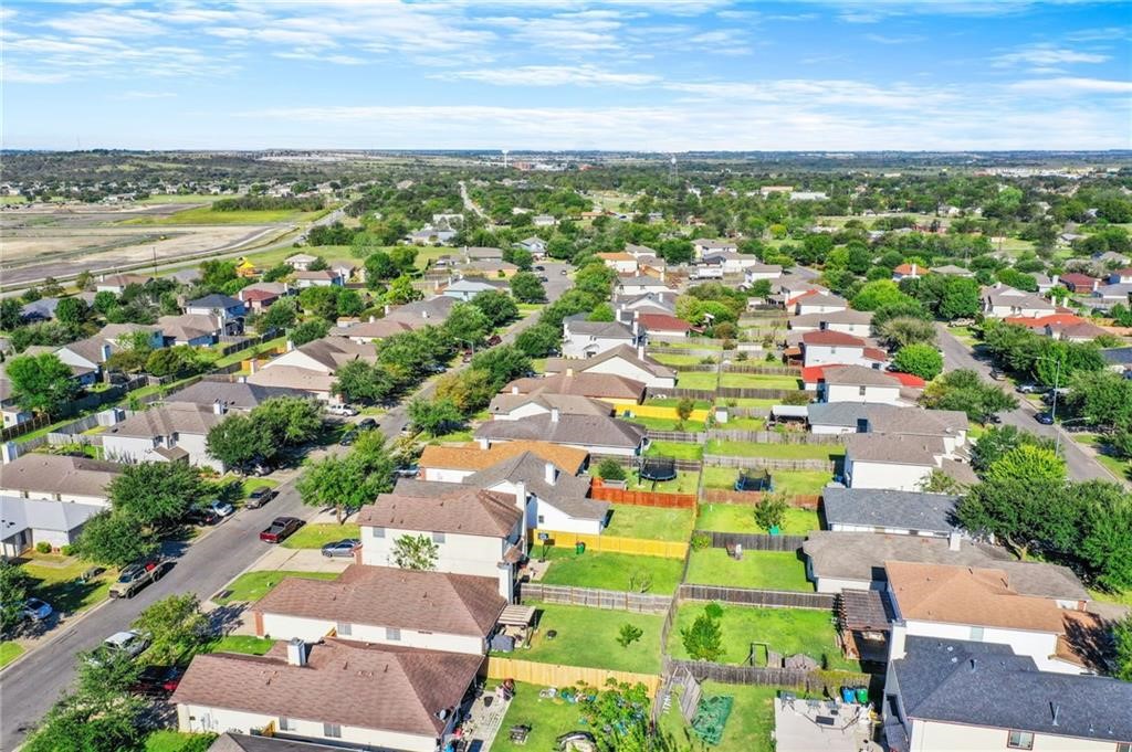 16724 Trevin Cove Manor, TX 78653 - Photo 31 of 32 an aerial view of residential houses with outdoor space