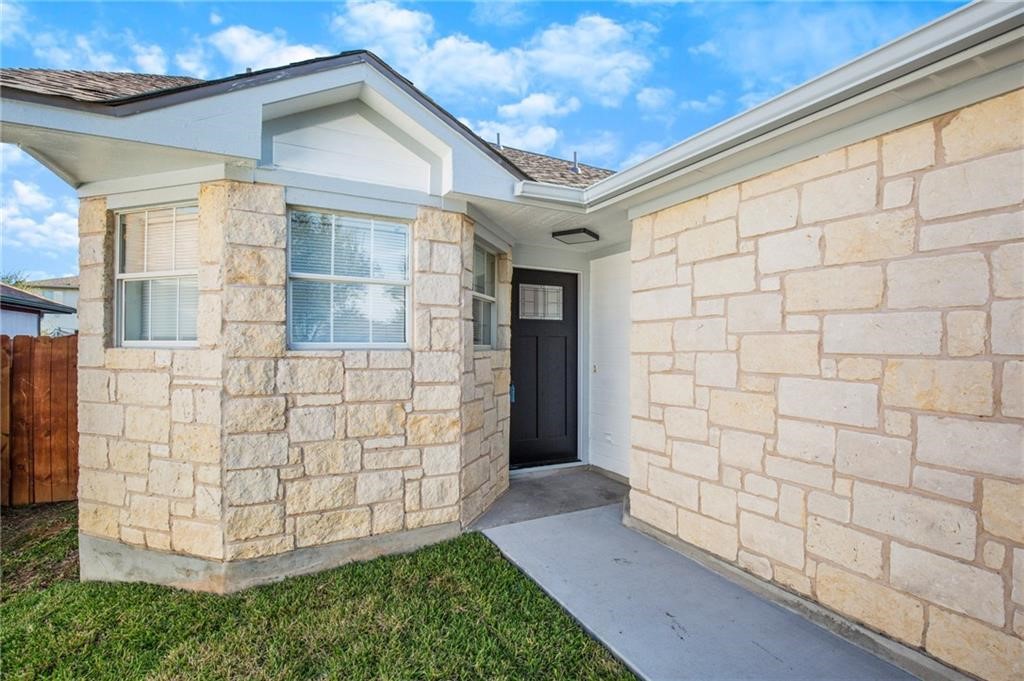 16724 Trevin Cove Manor, TX 78653 - Photo 4 of 32 a view of outdoor space garage and yard