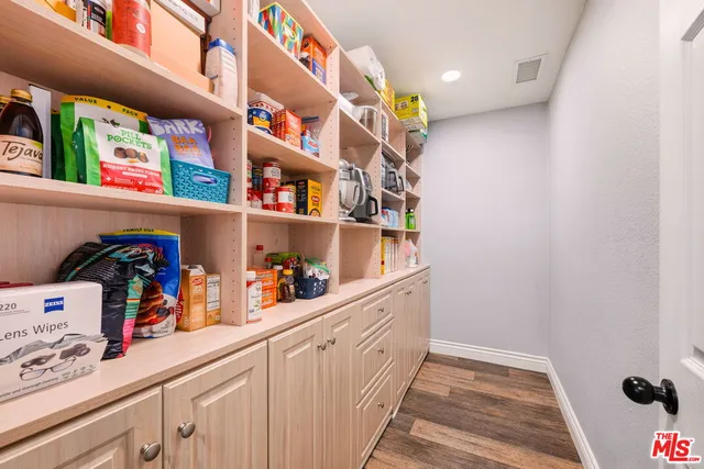 a hallway with toys and wooden floor