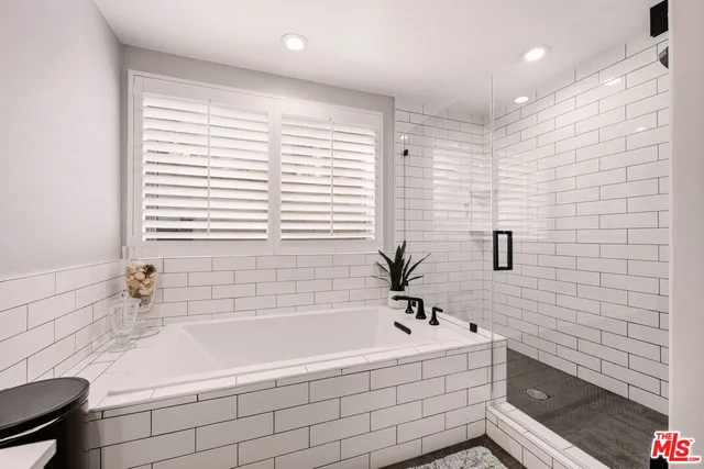 a bathroom with a bathtub and a sink