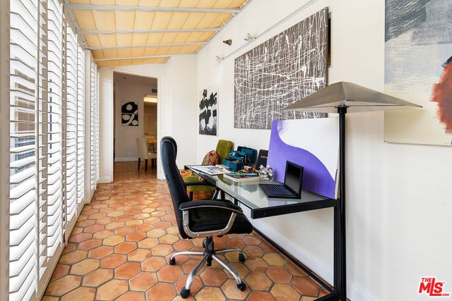 a workspace with furniture and window