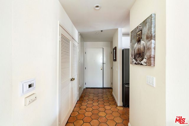 a view of a hallway with closet