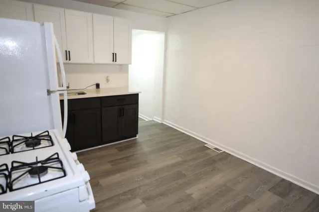 a kitchen with a sink and a stove