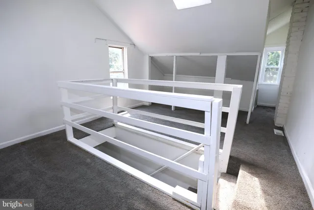 a living room with a furniture and a window