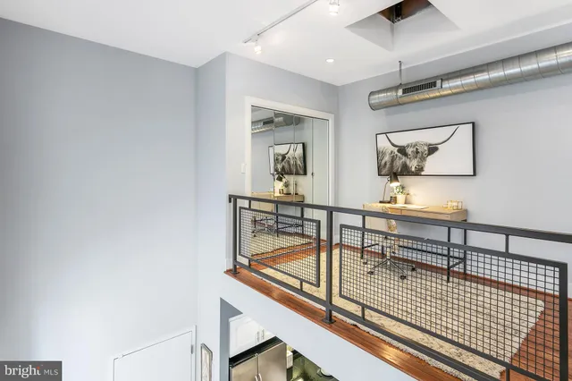 a view of a hallway with seating area