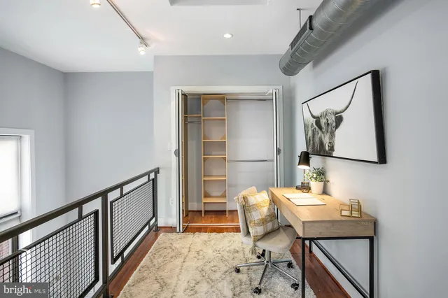 a workspace with furniture and window