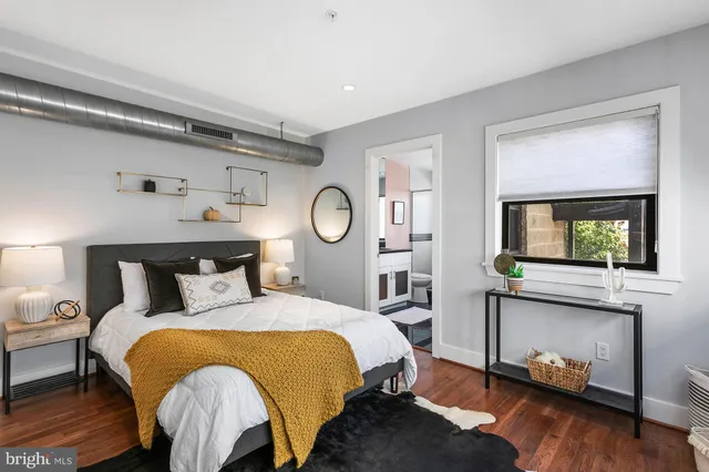 a bed room with a bed and a tv