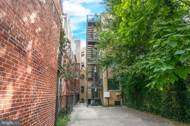 a building with a tree in front of it