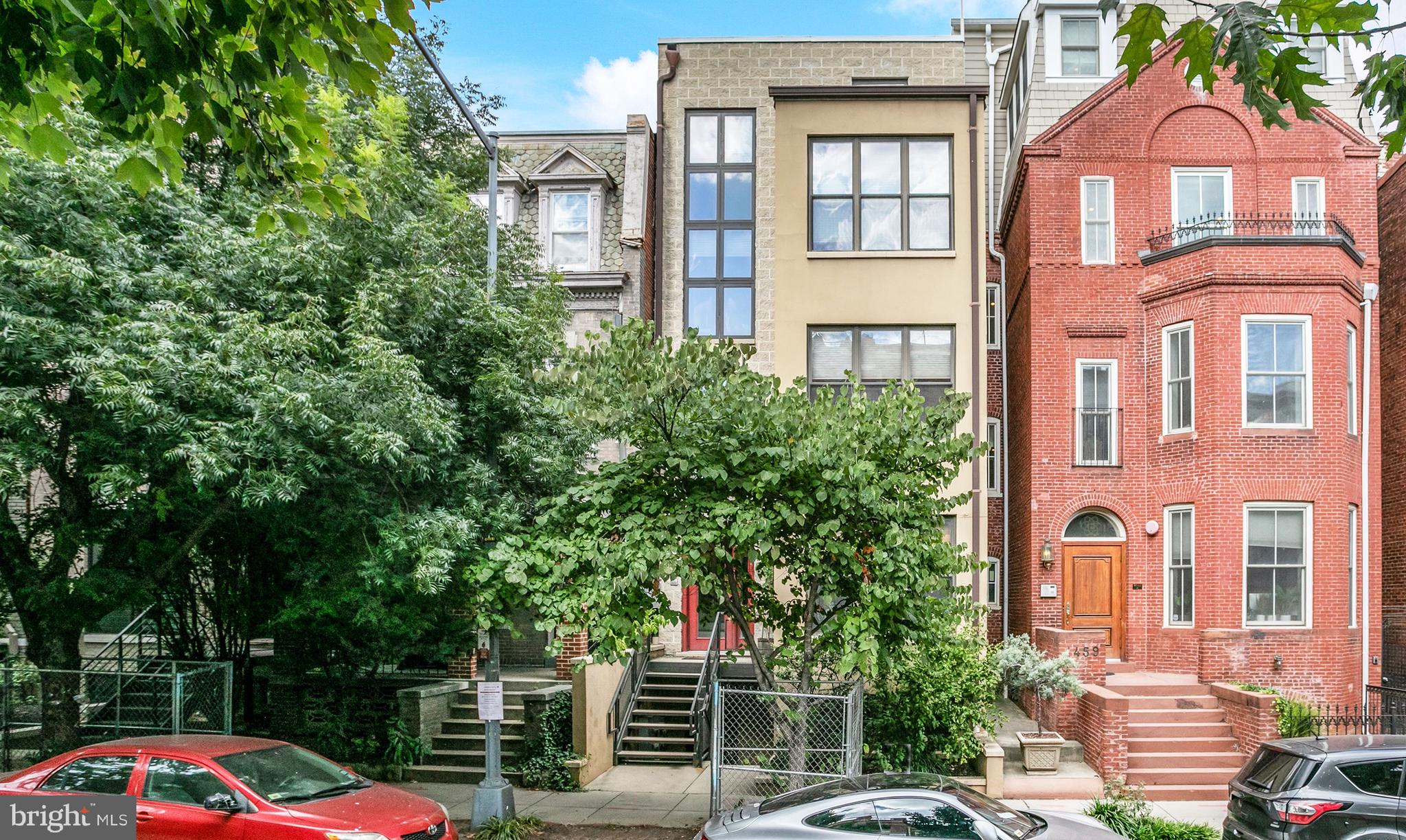 1461 Harvard Street Northwest, Unit 5 Washington, DC 20009 - Photo 29 of 33 a front view of a residential apartment building with a yard