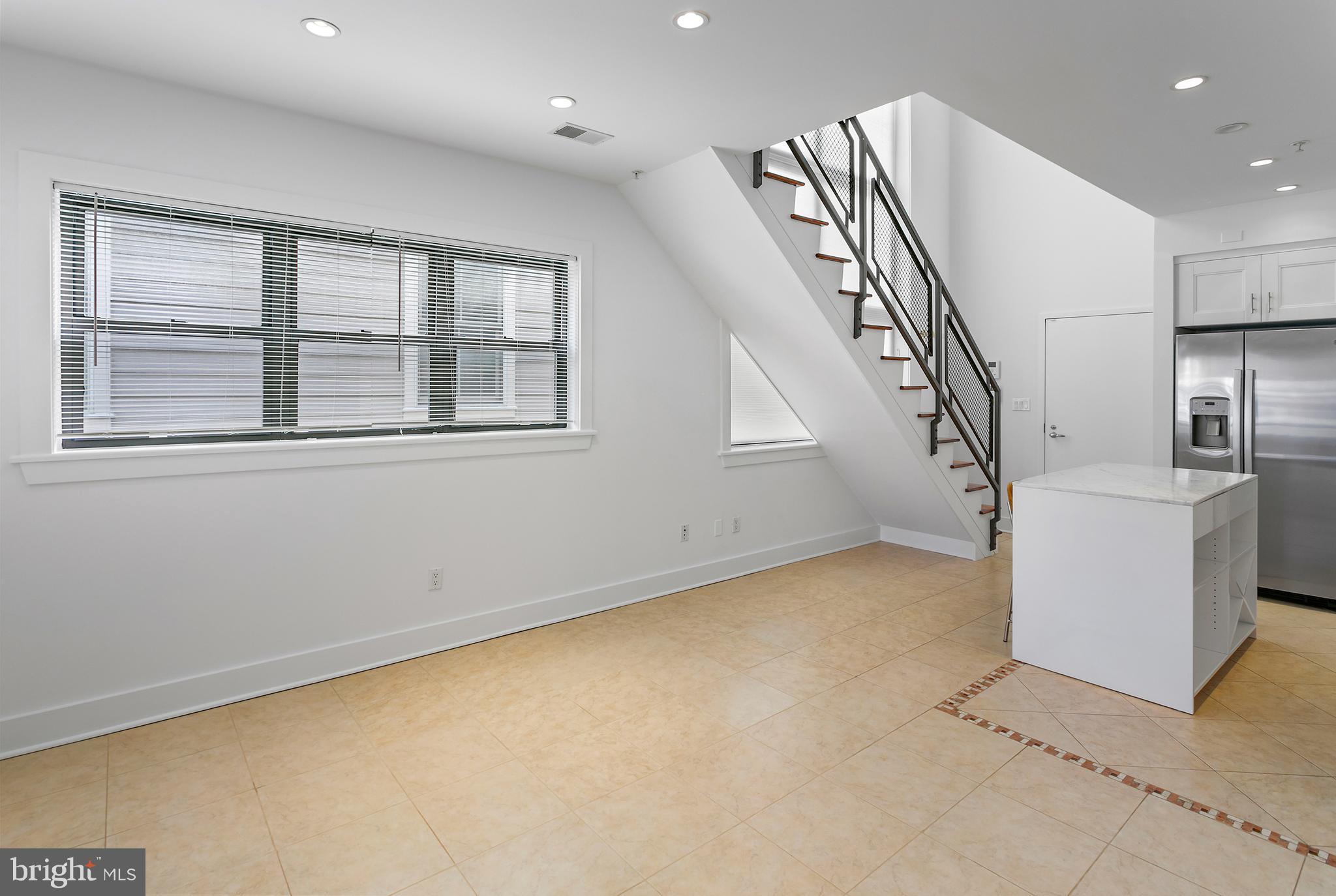 1461 Harvard Street Northwest, Unit 5 Washington, DC 20009 - Photo 4 of 33 a view of an empty room with a window
