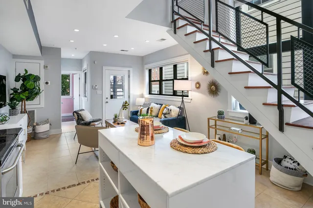 a kitchen with a table and chairs in it