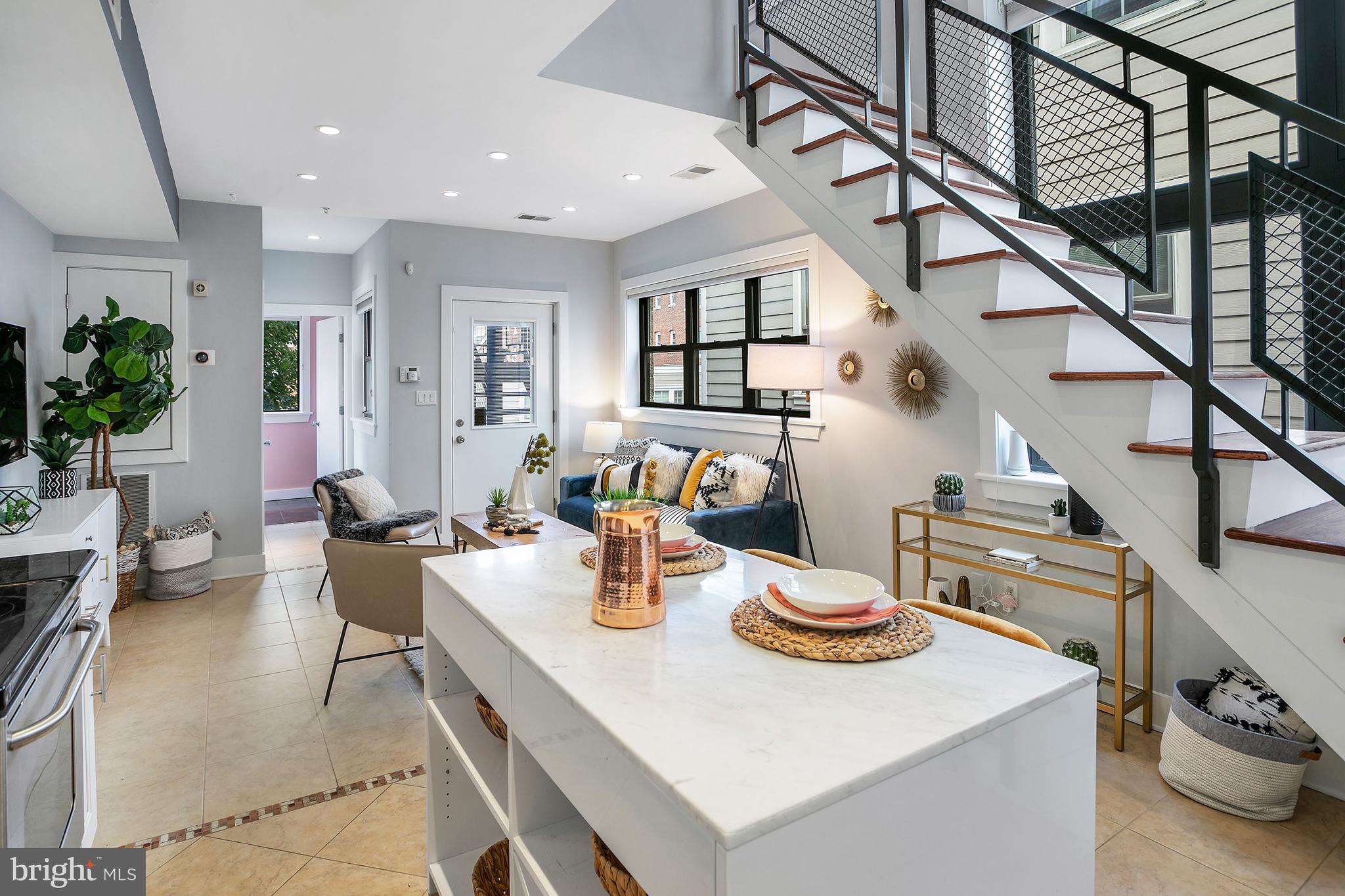 1461 Harvard Street Northwest, Unit 5 Washington, DC 20009 - Photo 7 of 33 a kitchen with a table and chairs in it