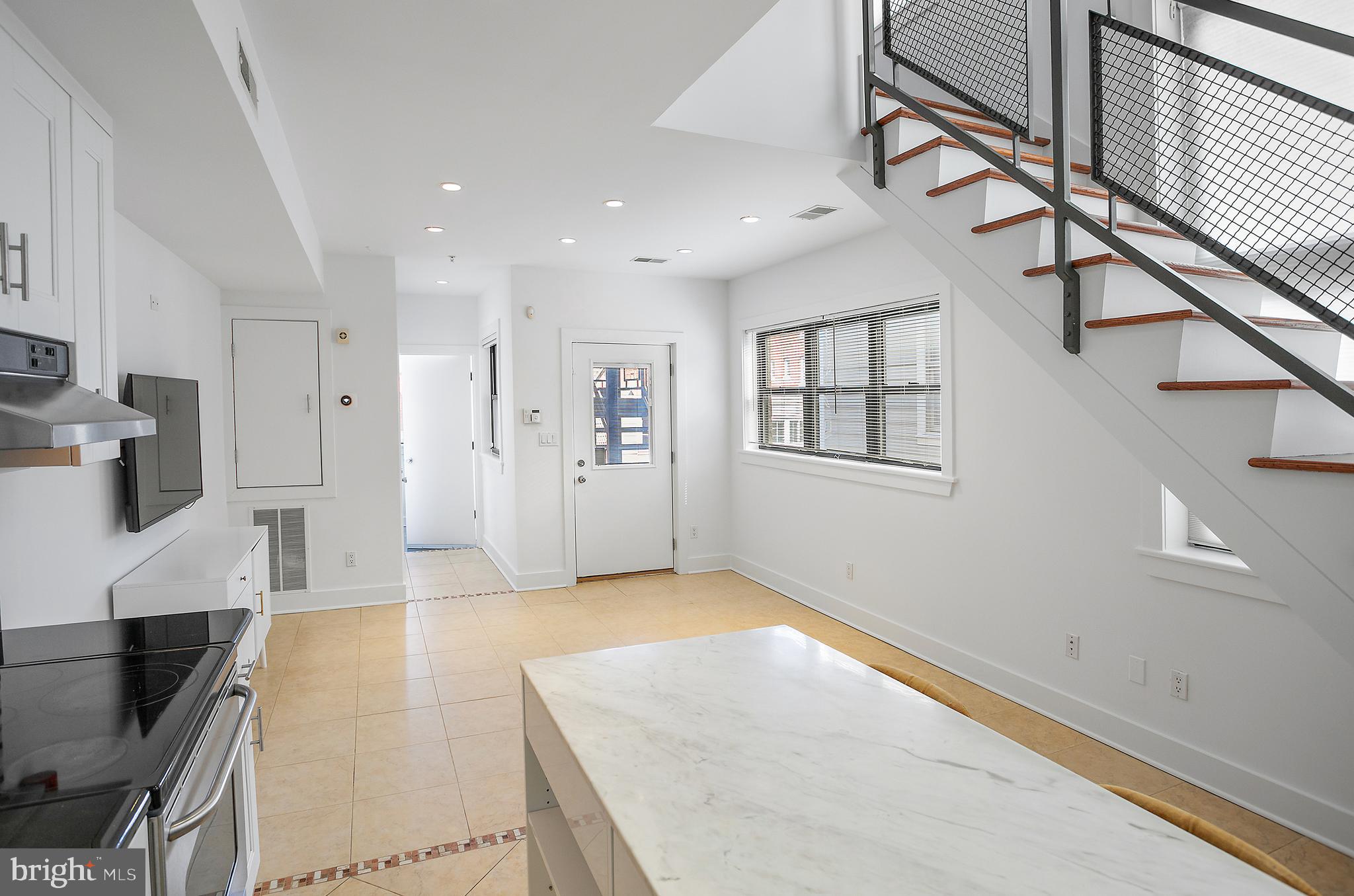 1461 Harvard Street Northwest, Unit 5 Washington, DC 20009 - Photo 8 of 33 a view of livingroom with furniture and workspace
