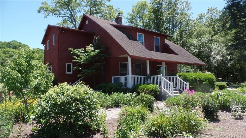 395 Pond Road Franklin, CT 06254 - Photo 1 of 1 a house that has a lot of plants in it