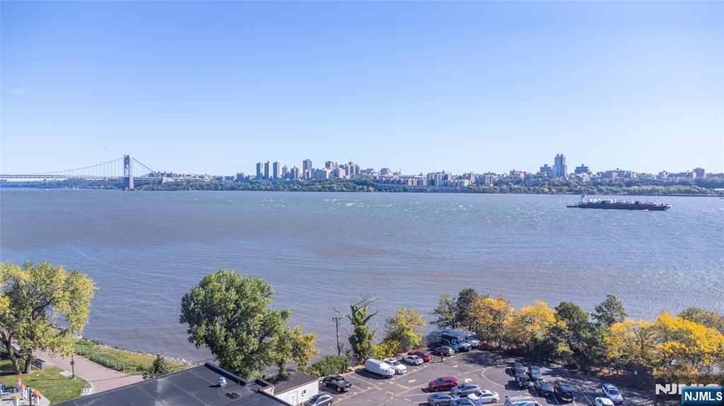 1111 River Road, Unit G5 Edgewater, NJ 07020 - Photo 13 of 20 a view of a lake with a mountain in the back