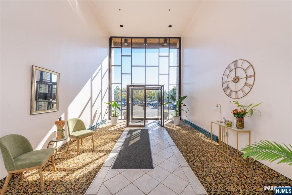 1111 River Road, Unit G5 Edgewater, NJ 07020 - Photo 14 of 20 a living room with furniture and a large window
