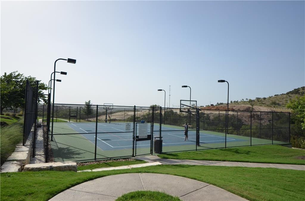 5629 Rio Chama Cove Austin, TX 78738 - Photo 31 of 34 An outdoor court offers space for recreation with dedicated lighting for extended play.